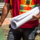 person holding drafting paper